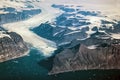 Western coast of Greenland, aerial view of glacier mountains and ocean