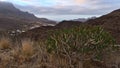 Western coast of island Gran Canaria, Spain with remote village La Aldea de San Nicolas surrounded by rugged mountains. Royalty Free Stock Photo