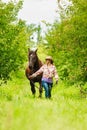 Western cowgirl woman with horse. Sport activity