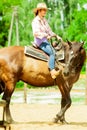 Western cowgirl woman riding horse. Sport activity