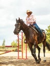 Western cowgirl woman training riding horse. Sport Royalty Free Stock Photo