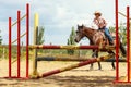 Western cowgirl woman training riding horse. Sport