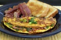 Western or Denver Omelet with toast and bacon Royalty Free Stock Photo