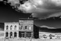 Western ghost town with dramatic clouds Royalty Free Stock Photo