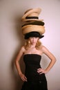 Western girl wearing many hats Royalty Free Stock Photo