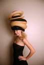 Western girl wearing many hats Royalty Free Stock Photo