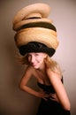 Western girl wearing many hats Royalty Free Stock Photo