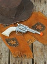 Western hat, vest, & toy gun.