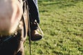 Boot in stirrup while horseback riding Royalty Free Stock Photo