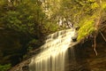 Close up of a mountain water fall streaming over the top Royalty Free Stock Photo