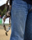 Western riding spurs hanging on belt