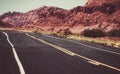 Western road at sunset, Desert highway of the American southwest. Royalty Free Stock Photo