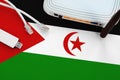 Western Sahara Flag Depicted On Table With Internet Rj45 Cable, Wireless Usb Wifi Adapter And Router. Internet Connection Concept