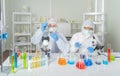 A western scientists couple working on test tube to analysis and develop vaccine of covid-19 virus in lab or laboratory in Royalty Free Stock Photo