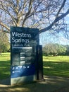 The shadow of the tree in the morning is reflected on the entrance stand of Western Springs Lakeside Park.