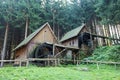 Western style pioneer frontier water mill wheel wooden building in the forest Royalty Free Stock Photo