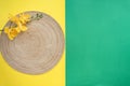 Hari Raya Aidilfitri table setting with traditional table mat and dinnerware with green and yellow background. Royalty Free Stock Photo