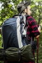 A western tourist trekking in a forest