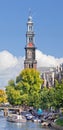 Western Tower, part of Western Church, with canal and tour boat, Amsterdam.