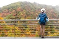 Westerner traveller woman with map in hand admiring view of atumn landscape in japan Royalty Free Stock Photo
