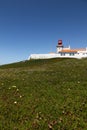 The westernmost lighthouse of Cabo da Roca in Porugalia with the yellow-flowered Hottentot fig growing