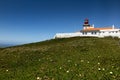 The westernmost lighthouse of Cabo da Roca in Porugalia with the yellow-flowered Hottentot fig growing