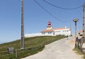 The westernmost lighthouse of Cabo da Roca in Porugalia with the yellow-flowered Hottentot fig growing