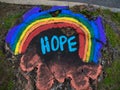 Westfield, NJ 04/17/20: Hope Written On A Tree Stump With A Rainbow To Bring Hope To People Who Suffer From Corona Virus/Covid-19