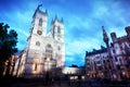 Westminster Abbey church facade at night, London UK.