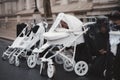 Extinction Rebellion activists kneeling in front of Downing Street with White Baby Prams