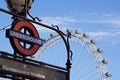 Westminster sign and the London eye blue sky Royalty Free Stock Photo