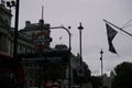 Westminster Tube Station with the UK national flag waving near Big Ben and Westminster Hall