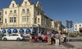 Fish chips and ice cream shops with holidaymakers crossing the street to enjoy. Royalty Free Stock Photo