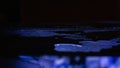 Wet asphalt, night scene of an empty street with a little reflection in the water