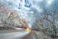 Wet asphalt road winter panorama in countryside travel on cold snowy day Royalty Free Stock Photo