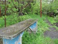 Wet bench in the garden after the rain. Royalty Free Stock Photo