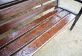 Wet bench after rain standing in the park