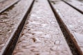 Wet bench surface in perspective. Wooden surface with water droplets in perspective. Royalty Free Stock Photo