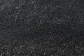 Wet bitumen texture. Black glitter background.