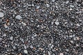 Wet black pebbles Beach Vik, Iceland Royalty Free Stock Photo