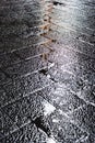 Wet black stone pavement after rain Royalty Free Stock Photo