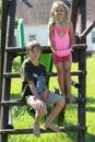 Wet boy and girl on slide Royalty Free Stock Photo