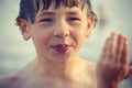 Wet Boy Wiping Water From Face Royalty Free Stock Photo