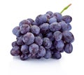 Wet bunch of blue grapes isolated on white background Royalty Free Stock Photo