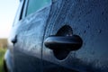 Wet car with door handle outdoors, closeup view Royalty Free Stock Photo