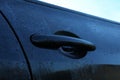 Wet car with door handle outdoors, closeup view Royalty Free Stock Photo