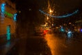 Wet the car window with background of the night city Royalty Free Stock Photo