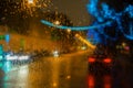 Wet car window with the background of t night Royalty Free Stock Photo