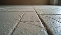 Wet cement adhesive applied between floor tiles preparing for grouting. Construction material spread on surface for tiling job. Royalty Free Stock Photo