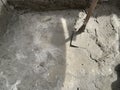Wet Cement Concrete Mixing with Shovel at Construction Site Royalty Free Stock Photo